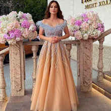 Load image into Gallery viewer, champagne beaded prom dresses 2020 off the shoulder feather elegant 2021 prom gown Vestidos