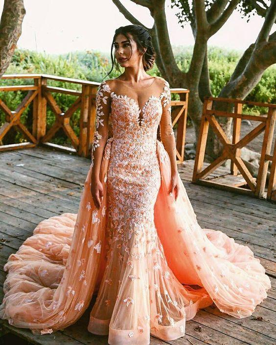 Beautiful young woman. Blonde long flowing hair. elegant airy peach beige ball  gown. evening long pink trendy tulle dress. backdrop white window vintage  classic room. Prom holiday image. Stylish look Stock Photo